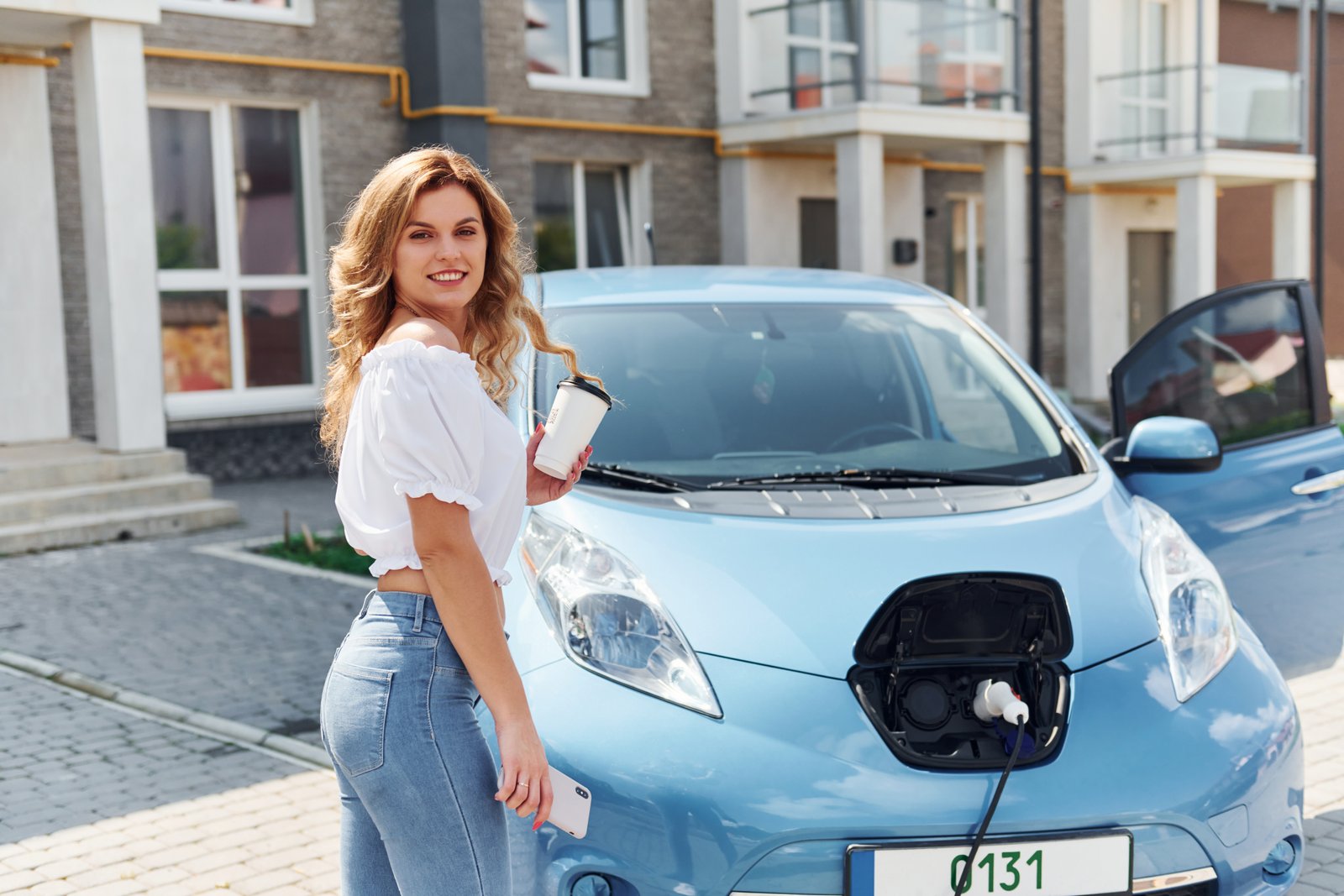 Woman with EV Car